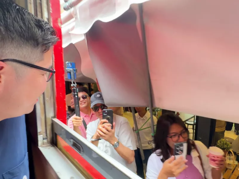 Train arrives at maeklong market with excited crowd